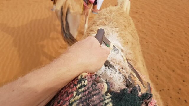 POV Man Camelback Riding In Desert