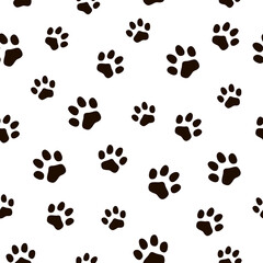 Fototapeta na wymiar Seamless pattern with animal paws. Traces of cats and dogs. Footprints of wild animals.