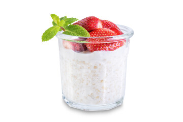 Oatmeal porridge with milk and fresh strawberries in a glass on a white isolated background