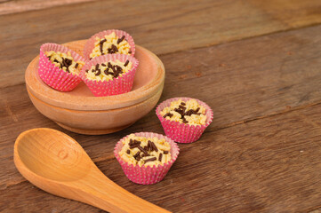 Angle view of Malaysian traditional homemade cookies called as Kuih Sarang Semut with chocolate rice served during Eid Fitri