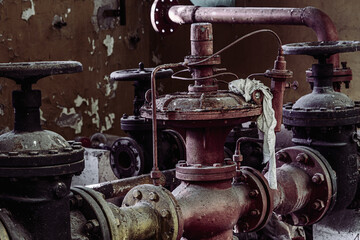 abandoned industrial area with pipes and taps