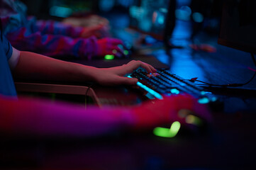 The hands of a male gamer during a tense game, the keyboard and mouse are visible.