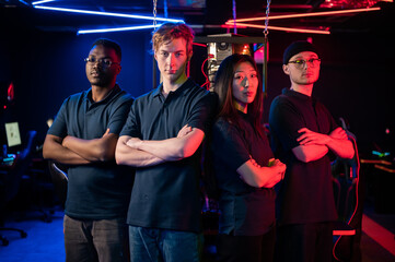 To represent the teams at the grand esports tournament, multinational guys and a girl look into the...
