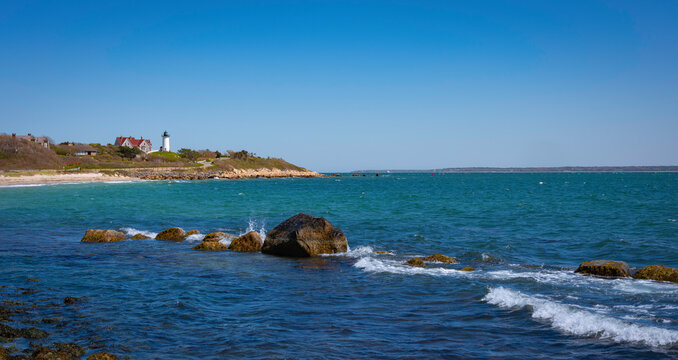 Seascape with a view of Nobska Light House and Glacial Rocks on Cape Cod Beach. Panoramic image of coastal road trip in Woods Hole in Massachusetts. 