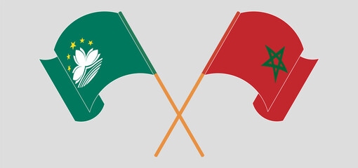 Crossed and waving flags of Macau and Morocco