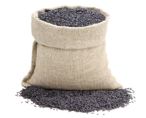 Seeds of black sesame in a sack of isolated on a white background. Unpeeled sesame seeds.Black...