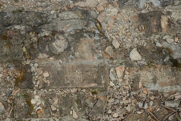 Fototapeta premium brown gray stone texture of old dirty bricks in a building wall