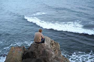 Sitting alone in frustration viewing the ocean 2