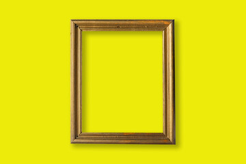 gold photo frame in a yellow wall