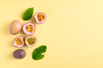 Fresh passion fruit on yellow background with copy space, Flat lay, Top view
