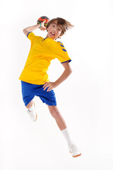 Full length photo of a young sporty boy throwing handball to the camera, - 433148833