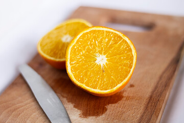 juicy fruit orange on cutting board and knife citrus