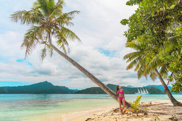 Beach vacation summer paradise destination in Bora Bora island, Tahiti, French Polynesia island cruise excursion. Woman in bikini relaxing on idyllic holiday secluded getaway.