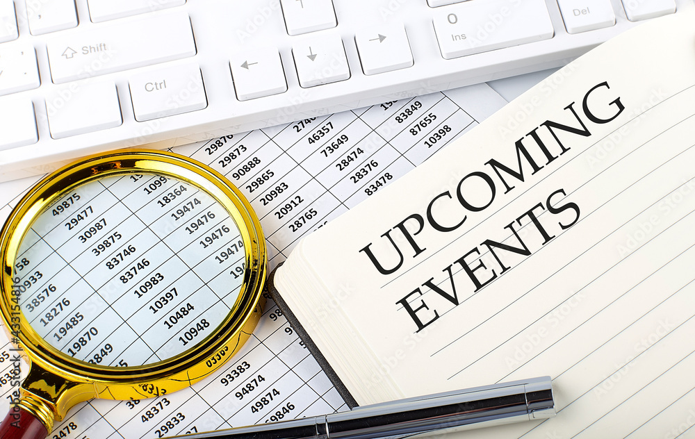 Poster upcoming events text on notebook with chart, magnifier,keyboard and pen