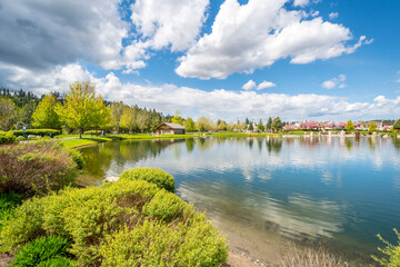 Fototapeta na wymiar Riverstone public park and lake during spring in the Riverstone commercial development in downtown Coeur d'Alene, Idaho, USA