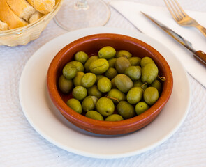Close up of green olives - snack in Mediterranean cuisine