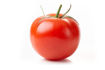 One fresh red tomato isolated on a white background.