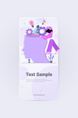 businesswoman putting cogwheels in open human head mental health thinking process brainstorming concept