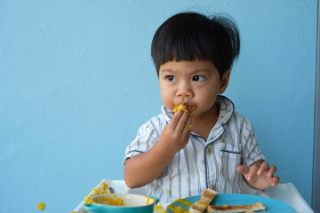 child eating cake