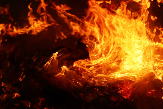 Background image of swirling flames approaching