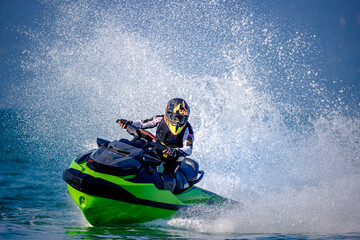 Fototapeta na wymiar A man driving a jet ski