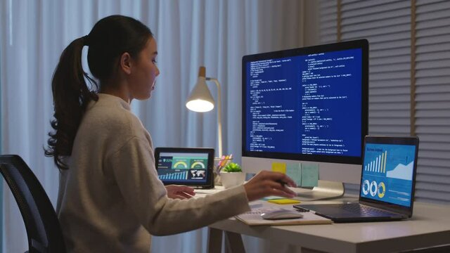 Back view young asia female people analyst coder code language multiple screen cloud online computing ai deep tech work at home office late night reskill upskill, future agile cyber ux web design job.