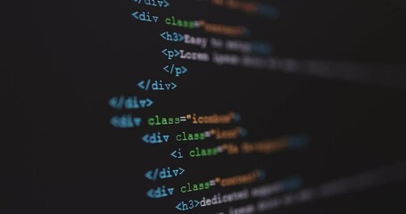 4K Close up shot HTML tag code on PC Monitor scroll down. Background concept for programming and coding web development. - Powered by Adobe