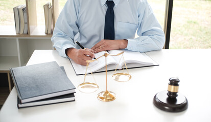 Lawyer Legal counsel presents to the client a signed contract with gavel and legal law. justice and...