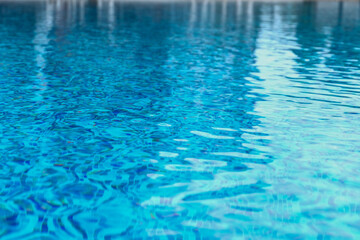 Obraz na płótnie Canvas Abstract pool water. Swimming pool flow with waves background surface of blue swimming pool