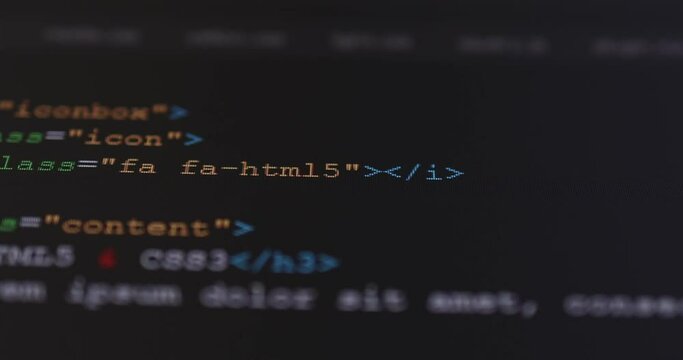 4K Close up shot HTML tag code on PC Monitor scroll down. Background concept for programming and coding web development.