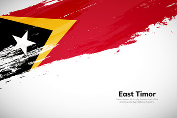 Brush painted grunge flag of Timor Leste country. Hand drawn flag style of Timor Leste. Creative brush stroke concept background