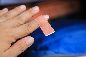 finger sticking plaster bandage from hurt wound injury of knife cutting