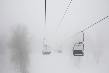 lift cable car in heavy fog