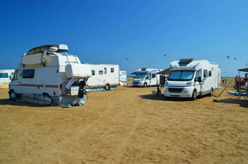 caravans cars parked on the beach of prasonisi in rhodes island greee
