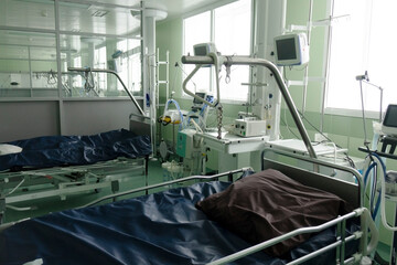 A hospital room with empty beds in a clinic or hospital.