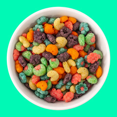 Top view of bowl with fruit cereal naturally and artificially fruit flavored sweetened corn puffs. Cereal fruity shapes
