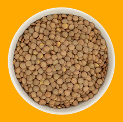 Lentils in a Ceramic Bowl. These nutritious legumes are high in protein and fiber. The image is a cut out, isolated on a white background, with a clipping path.