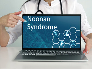  Noonan Syndrome text in menu. Immunologist looking for something at laptop