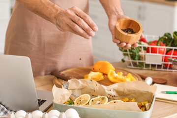 Young man cooking in kitchen