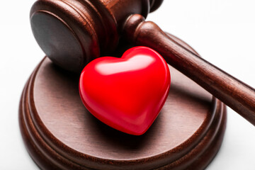Judge's gavel and heart, closeup