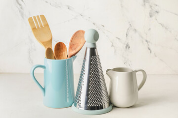 Set of kitchen utensils on light background