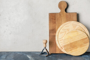 Wooden chopping boards and mold on light background