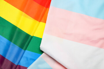 Transgender and rainbow LGBT flags as background