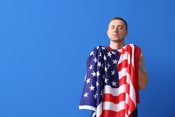 Man with USA flag on color background. Memorial Day celebration