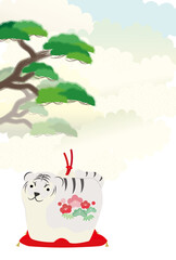 トラの置物と松の木と雲が背景にある年賀状イラスト