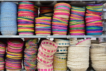 Colorful baskets and utensils made by hand with natural fiber. Crafts made with vegetable fiber in Mexico.