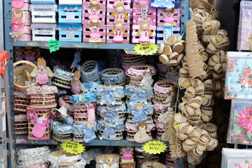 Colorful baskets and utensils made by hand with natural fiber. Crafts made with vegetable fiber in...