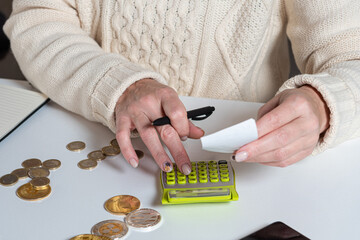 female hands counting data vat taxes cost doing paperwork at home office table