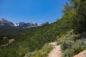 Naklejka na ściany i meble Bierstadt Lake Trail with blue sky and mountains in background in Rocky Mountain National Park, Colorado 