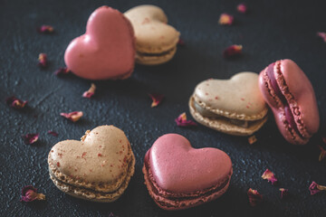 Heart shaped macarons on dark blue background